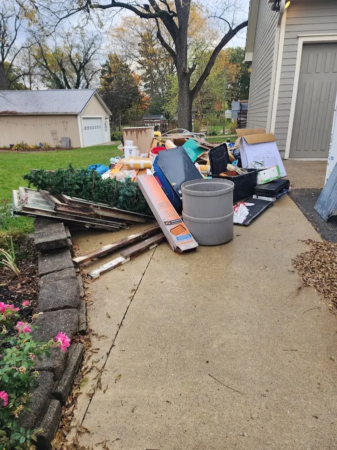 Dumpster being loaded with debris for Commercial Dumpster Rental in Port Angeles